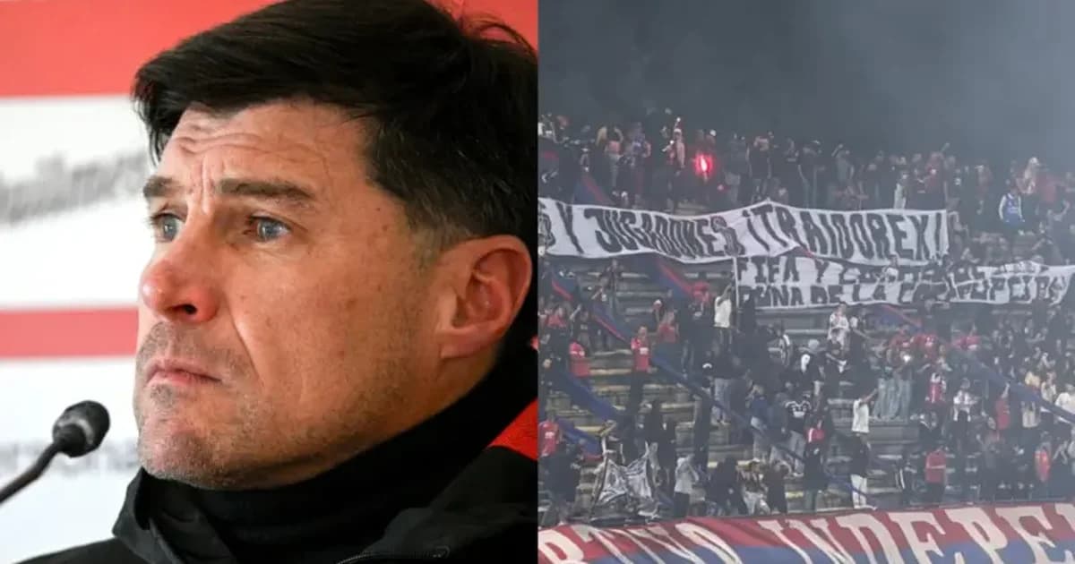 Estádio vazio após suspensão do jogo do Flamengo na Libertadores: fumaça, faixas rasgadas, placar mostrando 'W.O.?' e clima tenso.