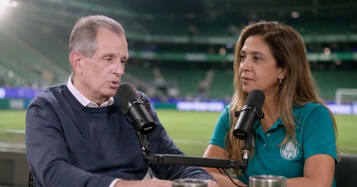 Dirigentes no centro do estádio apertam mãos entre tons rubro e verde, simbolizando diálogo institucional e reconciliação.