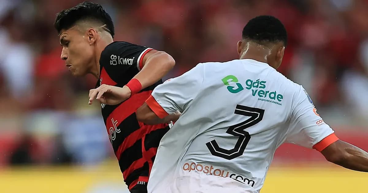 Silhueta de lateral-esquerdo em campo, tons vermelho e preto, documentos de contrato ao lado, clima de incerteza no Flamengo