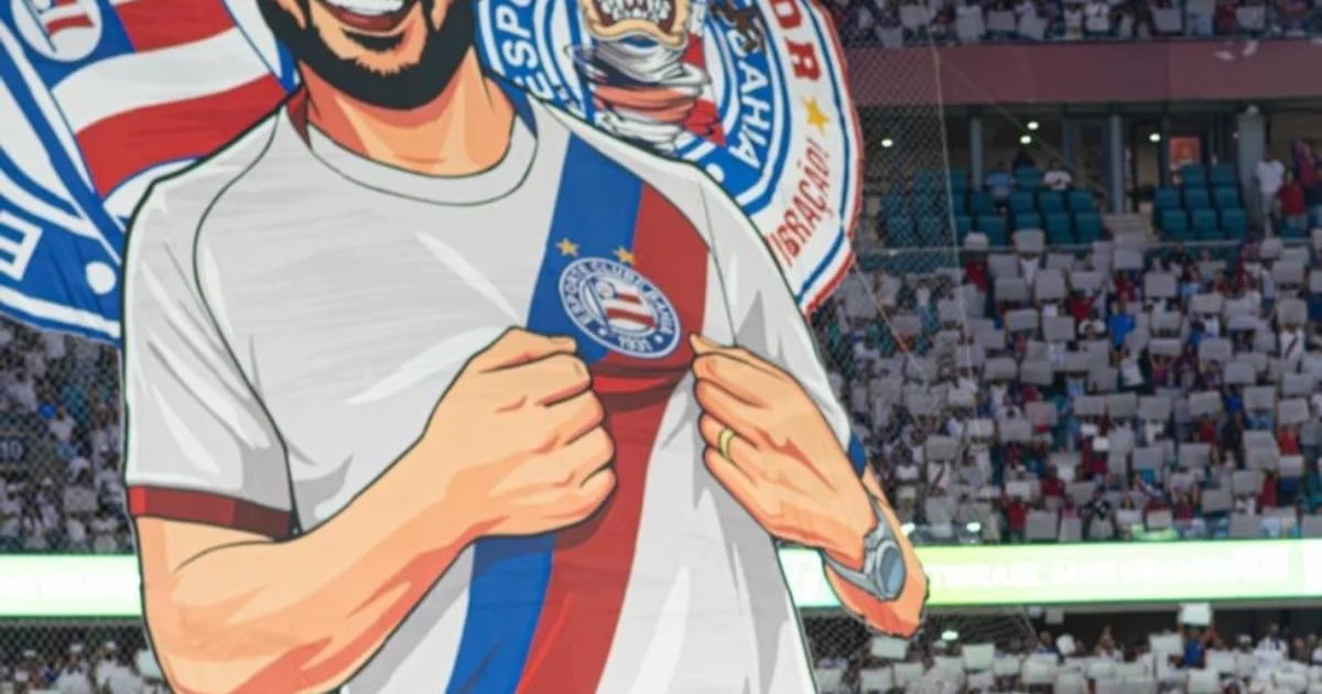 Torcida tricolor cria mosaico 3D nas arquibancadas com meia número 10 segurando um escudo e a frase 'O que nos cura todo dia é o Bahia'