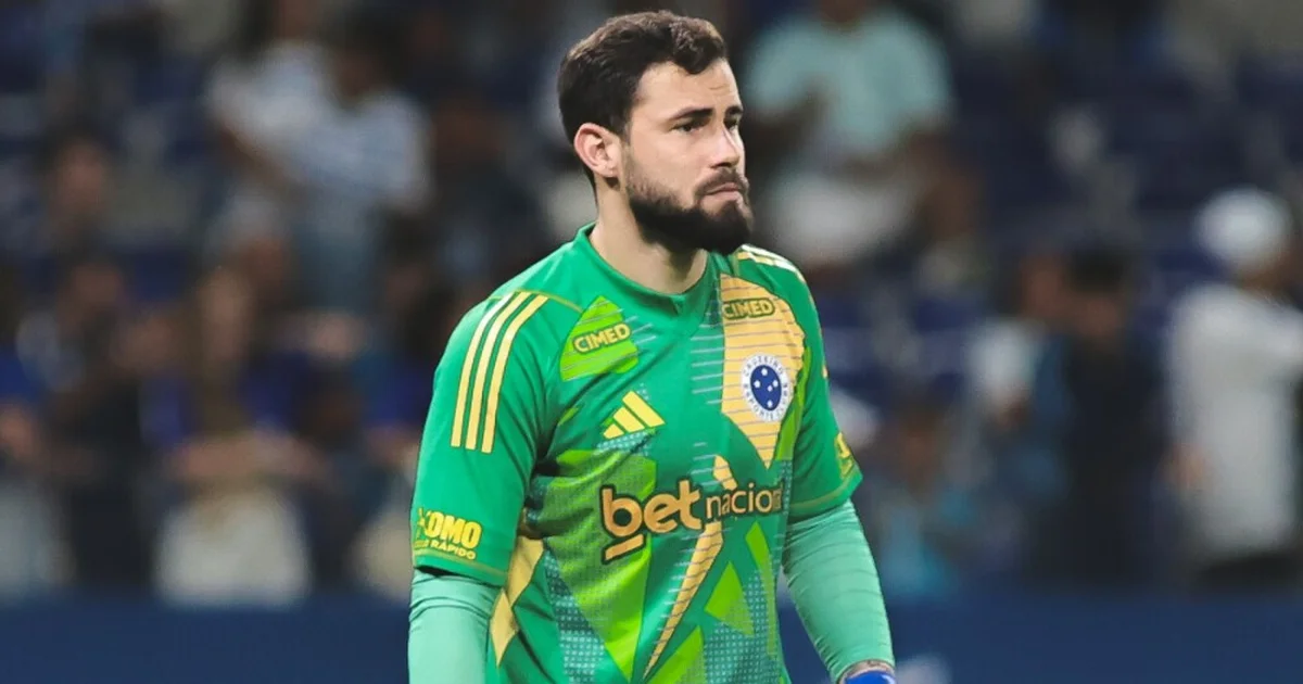 Ilustração editorial: goleiro segurando o joelho lesionado em estádio lotado, equipe médica correndo; impacto e tensão para Cruzeiro x Flamengo.